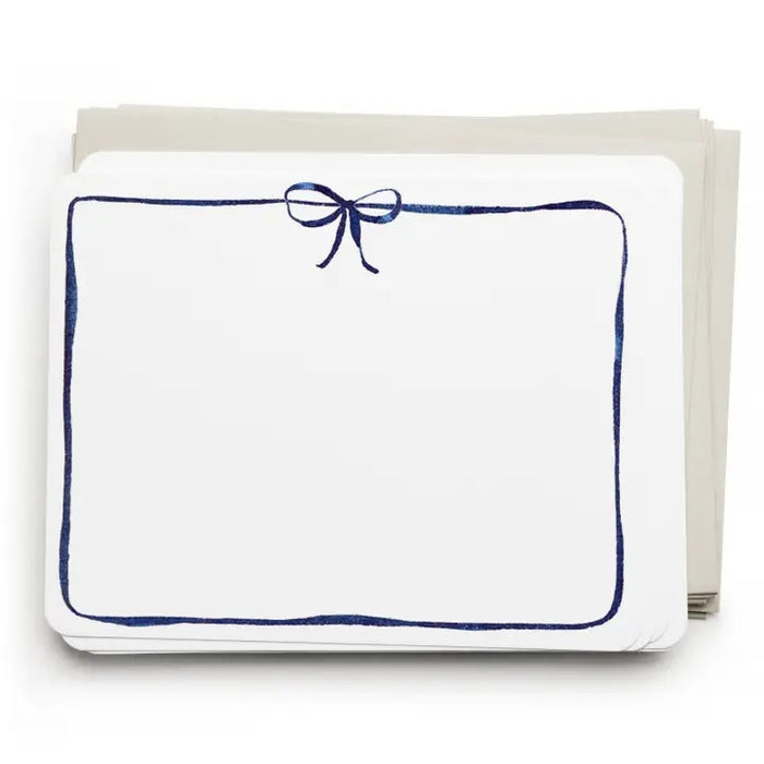 E. FRANCES PAPER's Flat Notes Navy Bow set includes illustrated notecards with matching envelopes, each featuring a blue border and navy bow. Partially boxed with a green band label—ideal for handwritten notes.