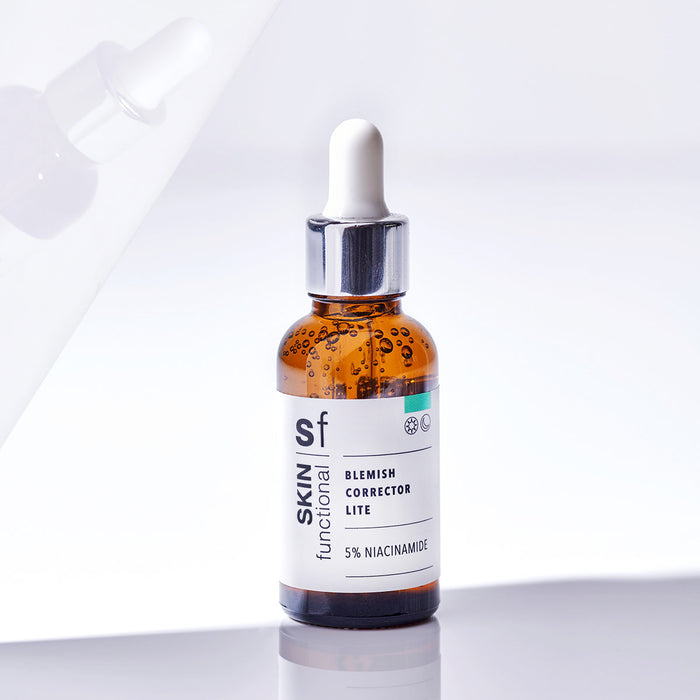 SKIN Functional Blemish Corrector Lite with details skincare product on a light gray background