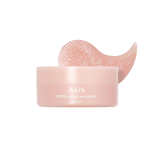 ABIB PDRN Retinal Eye Patch Glow Jelly is a soothing and revitalizing hydrogel eye patch designed to brighten and firm the delicate under-eye area. Enriched with Niacinamide, Caffeine, and Retinal, it targets dark circles and fine lines while Sodium DNA (a form of PDRN) supports skin regeneration. With Collagen, Squalane, and Sodium Hyaluronate, it delivers lasting hydration, and calming botanicals like Centella Asiatica help reduce puffiness. The jelly texture adheres comfortably, leaving the s
