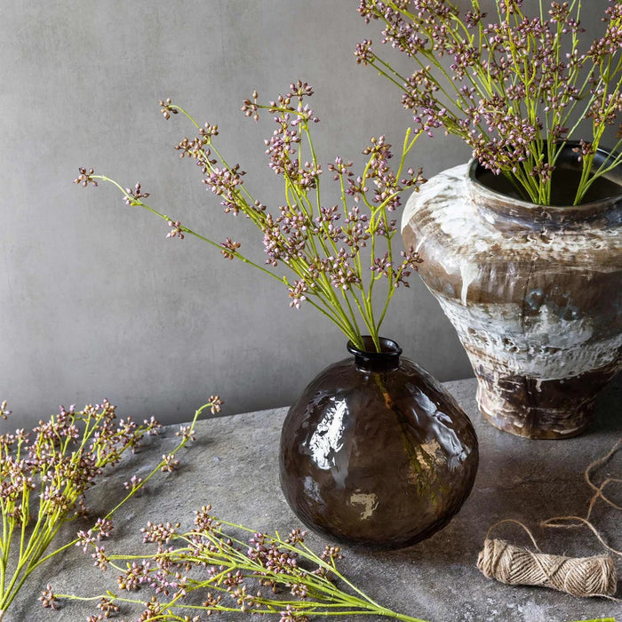 The ABIGAIL AHERN - BLUSH SUCCULENT BUNCH features small purple flowers and green stems tied with twine—a stylish artificial accent perfect for home decor. Add charm to any space with this unique piece from ABIGAIL AHERN.
