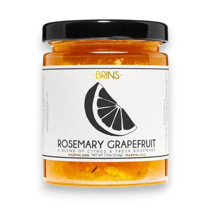 A jar of BRINS - ROSEMARY GRAPEFRUIT MARMALADE featuring a black lid and a label with a grapefruit slice and flavor description. This vegan spread from BRINS combines vibrant citrus with fragrant rosemary for a distinctive and delicious marmalade.