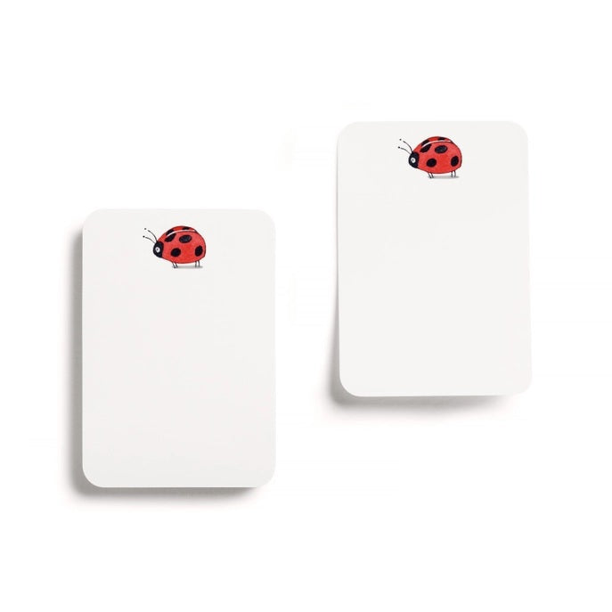 E. FRANCES - LITTLE STICKIES LADYBUG by E. FRANCES PAPER: Two rectangular white notecards, each with a small red and black ladybug in the top left corner. The cards are blank and set against a white background, resembling cute ladybug sticky notes.