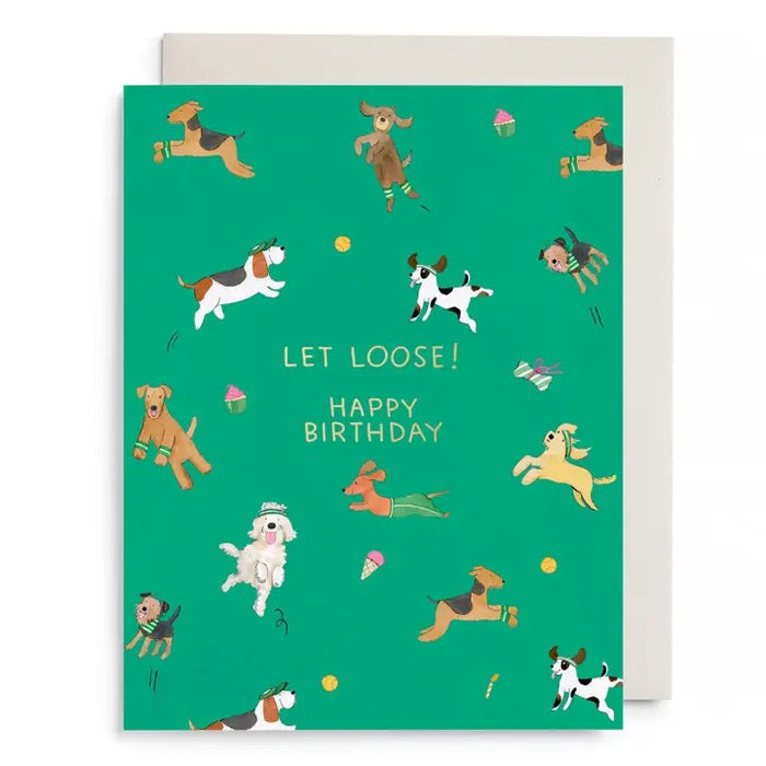 The E. FRANCES - OFF LEASH BIRTHDAY CARD by E. FRANCES PAPER features playful cartoon dogs, toys, and treats with "LET LOOSE! HAPPY BIRTHDAY" in gold foil and comes with a white envelope.