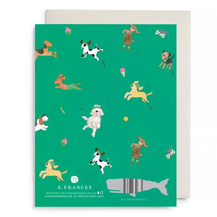 The E. FRANCES - OFF LEASH BIRTHDAY CARD by E. FRANCES PAPER features playful cartoon dogs, toys, and treats with "LET LOOSE! HAPPY BIRTHDAY" in gold foil and comes with a white envelope.