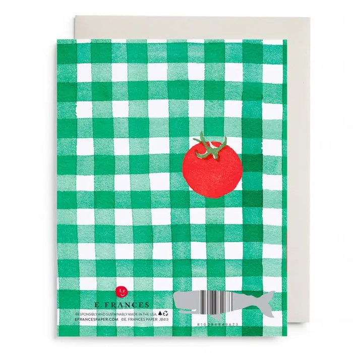 E. FRANCES PAPER’s Tomato Picnic Love & Friendship Card features a green and white checkered design, a red tomato, and gold “Warm sun, sweet days, only thing missing is you.” text. Made in the USA. Envelope included.