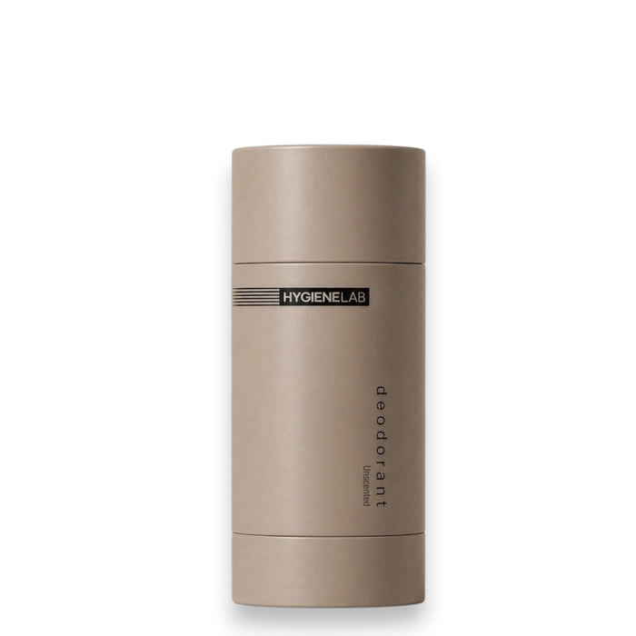 A beige cylindrical stick of HYGIENELAB - DEODORANT, UNSCENTED stands upright on a neutral background, featuring its aluminum-free formula for gentle, non-toxic 24-hour protection.