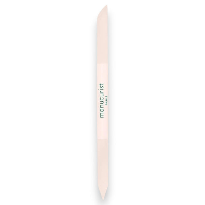 A light pink, double-ended MANUCURIST - GLASS CUTICLE PUSHER with “manucurist PARIS” printed in green at the center, displayed on a white background—an essential reusable nail tool from MANUCURIST INC for any manicure routine.