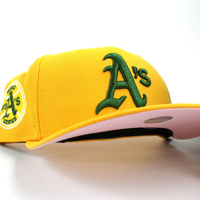 Oakland Athletics 1973 World Series New Era 59Fifty Fitted Hat (Gold Pink Under Brim)