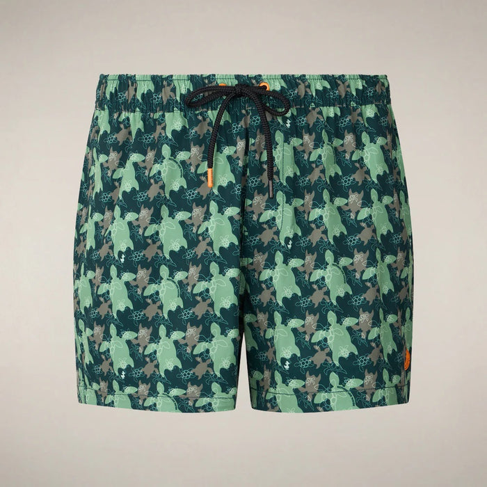 SAVE THE DUCK ADEMIR swim trunks in green and gray turtle camouflage are crafted from recycled polyester, featuring a black drawstring and orange tag. These quick-dry men's shorts are shown on a plain background.