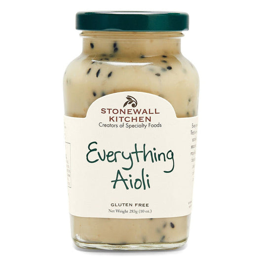 A glass jar of STONEWALL KITCHEN - EVERYTHING AIOLI with a green lid features a creamy, seasoned mayo-like spread. The label reads "Creators of Specialty Foods," "Everything Aioli," and "Gluten Free.