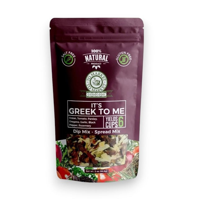 A purple bag of TO MARKET - IT’S GREEK TO ME DIP MIX by TO MARKET- DIPS & SPREADS sits beside a bowl of white dip served with crackers. The packaging highlights a 6-cup yield and features key ingredients like onion, parsley, and oregano, making it an ideal foundation for a Mediterranean spread—just add feta cheese and kalamata olives for an authentic flair.
