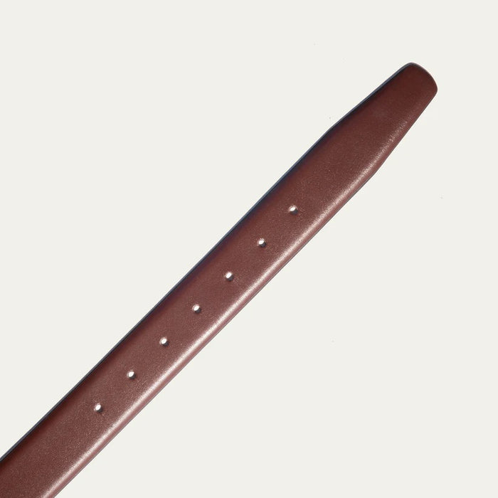 The WILL LEATHER GOODS Glazed Calfskin Belt in Cognac features a silver rectangular buckle and is shown diagonally on a plain white background.
